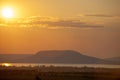 Sunset with lens flare over Lake Balaton and Badacsony mountain in Hungary