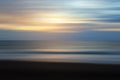 Sunset light background and soft blue sky over the sea horizon with smooth wave motion in digital effect.