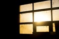 Sunset light through dirty stable window Royalty Free Stock Photo