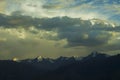 A sunset light on mountains snowy peaks