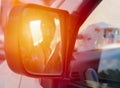 Sunset light reflected in the mirror of the car Royalty Free Stock Photo