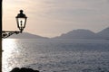 Sunset light on the sea of the Gulf of La Spezia. Street lamp in the marine village of Tellaro, near the CinqueTerre Royalty Free Stock Photo