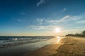 Sunset light shimmering water surface on tropical beach Royalty Free Stock Photo