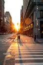 Sunset light shines on an empty crosswalk at the intersection of 23rd Street and 5th Avenue in Manhattan, New York City Royalty Free Stock Photo