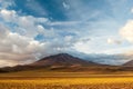 Sunset light on volcanos of Atacama Desert. Mountains southern from San Pedro de Atacama. Stunning scenery in evening sunlight at Royalty Free Stock Photo