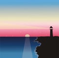 sunset and lighthouse on the shore Royalty Free Stock Photo