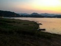 The sunset lighting of Kaeng Krachan dam phetchaburi. Royalty Free Stock Photo