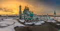 Sunset lights over Voskresensky cathedral golden domes, covered in snow, Resurrection or New Jerusalem Monastery, Istra, Moscow Royalty Free Stock Photo