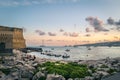 Sunset view of boats moored in the bay of Naples in southern Italy. Royalty Free Stock Photo