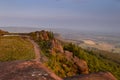 Sunset lights the trees, heather and rocks at the Roaches in the Peak District. Hen Cloud is in the dista Royalty Free Stock Photo