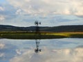 Sunset lights up a geothermal farm pond in FingerLakes