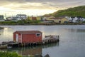 Sunset at little red dock house in village community of Twillingate, Newfoundland. Royalty Free Stock Photo