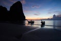 Sunset with longtail boat silhouette in Railay beach, Krabi - Thailand Royalty Free Stock Photo