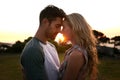 Sunset, love or couple in nature on romantic holiday vacation for bonding or relaxing on date together. Forehead, travel Royalty Free Stock Photo