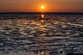 Sunset at low tide on the Nordstrand peninsula with a view of the Halligen