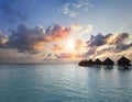 Sunset on Maldives island, water villas, bungalow on sea Royalty Free Stock Photo