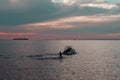 Sunset and man on water skis