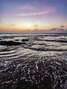 Sunset on Mandrem Beach in Goa, India. Bright and colorful sunset over the Indian Ocean, the Arabian Sea. A tropical Royalty Free Stock Photo