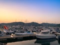 Sunset on the marina of Villasimius. Recreational boats are still in calm water