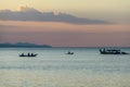 A sunset in Maumere, Flores, Indonesia. Serenity and calmness. There are few fishermen fishing from their boats in the bay. Some