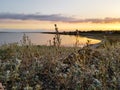 Sunset in the meadow near the estuary in early autumn. Royalty Free Stock Photo