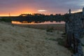 Sunset at the Mechelse Heide with a scenic view of being on the beach with sand and wooden poles