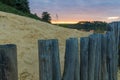 Sunset at the Mechelse Heide with a scenic view of being on the beach with sand and wooden poles