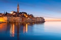 Sunset at medieval town of Rovinj, colorful with houses and church
