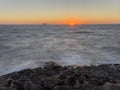 Sunset on the Mediterranean Sea with a far away seen island