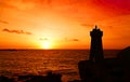 Sunset at Men ruz lighthouse at Pink Granite coast in Brittany Royalty Free Stock Photo