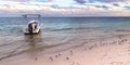 Fishing boat anchored on the shores of the Caribbean Sea. Photo at sunset on a summer day. Royalty Free Stock Photo