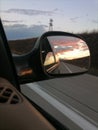 Sunset in the mirror of the car