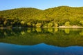 Sunset.Mirror surface of lake near Abrau Durso, Russia Royalty Free Stock Photo