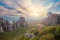 Sunset on monastery Agias Varvaras Roussanou on top of rock Meteora, Greece. Sunset sky with clouds and Meteora