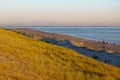 Sunset mood at beach landscape of reclaimed land in Netherlands