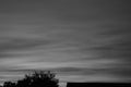 Sunset moody black and white soft flowing clouds horizontal