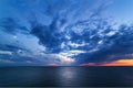 Sunset and moonrise over sea. Royalty Free Stock Photo