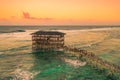 Sunset on most popular surfing area Cloud 9 at Siargao, Philippines. Aerial view raised wooden walkway for surfers to Royalty Free Stock Photo