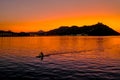 Sunset on Mount Igueldo and and man with a paddle in koyak in Donosti San Sebastian, Basque Country, northern spain Royalty Free Stock Photo