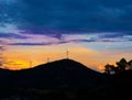 Sunset mountain with electric windmills Royalty Free Stock Photo