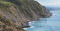 Sunset in the mountain natural coast landscape. Green valley on background dramatic sky, clouds, sea ocean. Panorama horizon Royalty Free Stock Photo