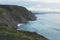 Sunset in the mountain natural landscape. Green valley on background dramatic sky, clouds, sea ocean. Panorama horizon perspective Royalty Free Stock Photo