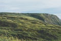 Sunset in the mountain natural landscape. Green valley on background dramatic sky, clouds, sea ocean. Panorama horizon perspective Royalty Free Stock Photo