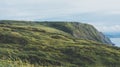 Sunset in the mountain natural landscape. Green valley on background dramatic sky, clouds, sea ocean. Panorama horizon perspective Royalty Free Stock Photo