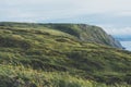 Sunset in the mountain natural landscape. Green valley on background dramatic sky, clouds, sea ocean. Panorama horizon perspective Royalty Free Stock Photo