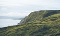 Sunset in the mountain natural landscape. Green valley on background dramatic sky, clouds, sea ocean. Panorama horizon perspective Royalty Free Stock Photo