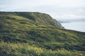 Sunset in the mountain natural landscape. Green valley on background dramatic sky, clouds, sea ocean. Panorama horizon perspective Royalty Free Stock Photo