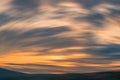 Sunset mountain round motion blur background. orange lines shadow cloudscape sky Royalty Free Stock Photo