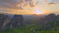 sunset in mountain valley with beautiful view in greece, kalabaka. Meteora monastery travel destination in Greece.