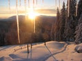 Sunset in the mountains at the icy window